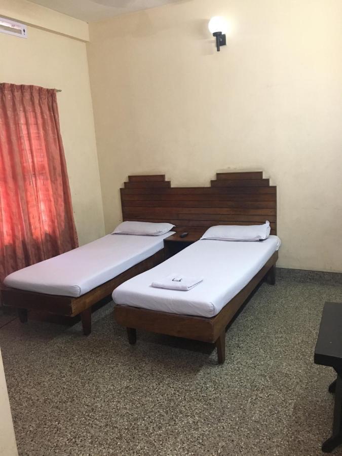 Nellimoottil Guest House กัตตะยัม ห้อง รูปภาพ